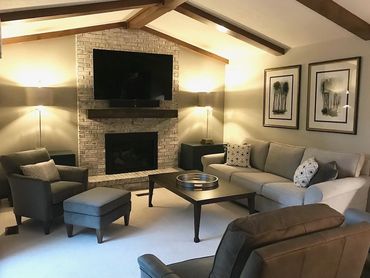 After: living room redesign with a statement fireplace, curated furniture by ID Cincinnati