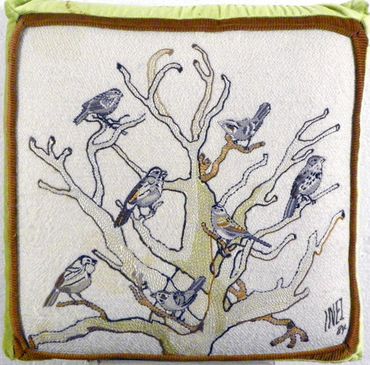 Birds embroidered pillow by Inez Running-rabbit.