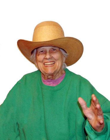 Inez Running-rabbit wearing one of Robin Henson's hats.
