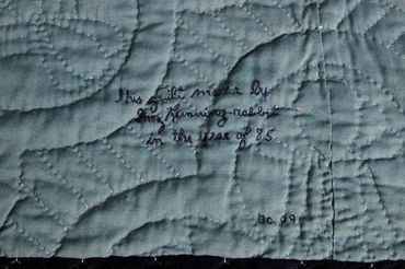 Close up of back of quilt handmade by Inez Running-Rabbit.