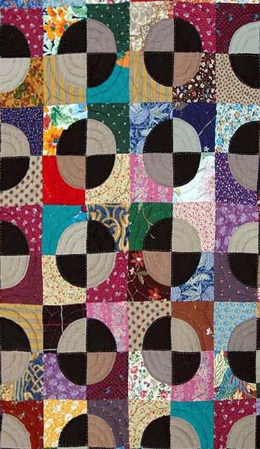 Close up of handmade quilt by Inez Running-Rabbit.