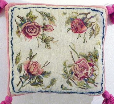 Rose embroidered pillow by Inez Running-rabbit.