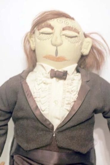 Close up of the Conductor Doll by Inez Running-rabbit.