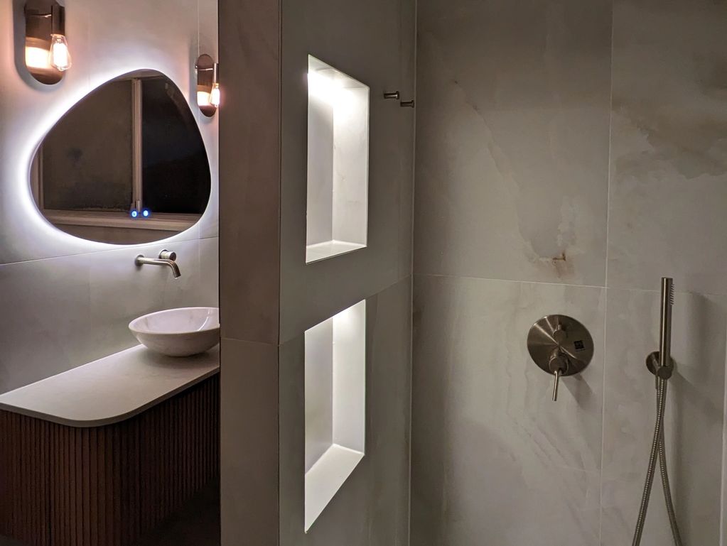 Custom-made luxury bathroom renovation with hidden lights and minimalist design