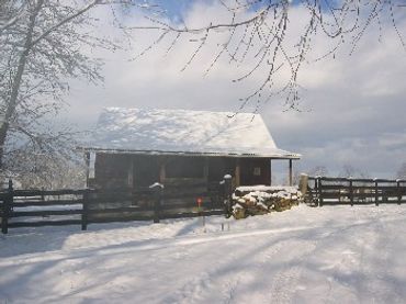 Outside stalls on a modified corn crib barn.