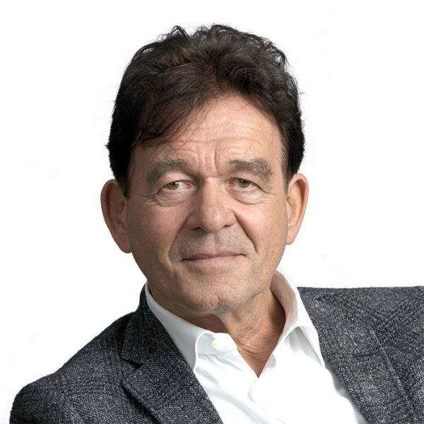 Portrait of a middle-aged man in a gray jacket.