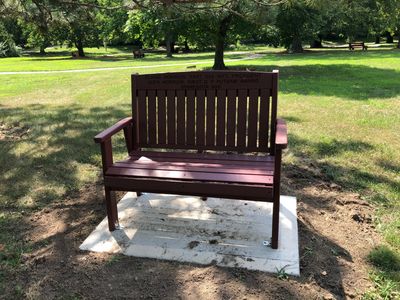 First bench by Minnesota tree.