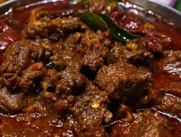 Spicy meat curry with rich sauce.