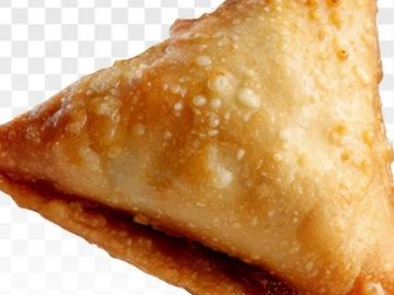 Close-up of a fried samosa.