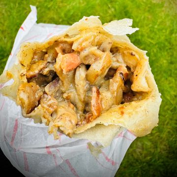 Close-up of a chicken shawarma wrap.
