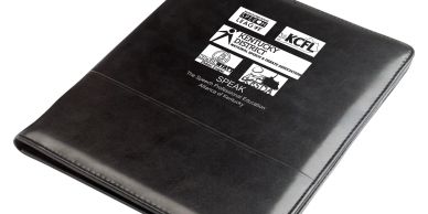 Black leather portfolio with logos and text.