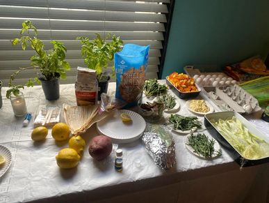 A table with herbs and tools used for spiritual work.