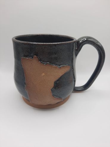 This glaze is called Cosmic Tea Dust, it sparkles in the sunshine.