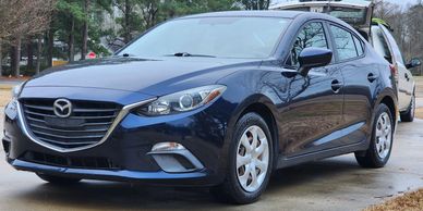 A Glossy Mazda sedan.