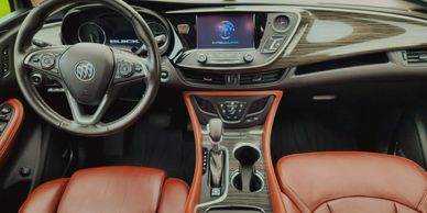 The freshly detailed cockpit of a Buick CUV or SUV.