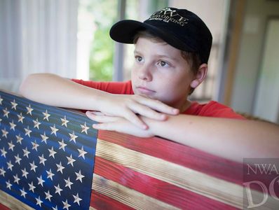 Jeremiah Lowe with our traditional American wooden Flag.