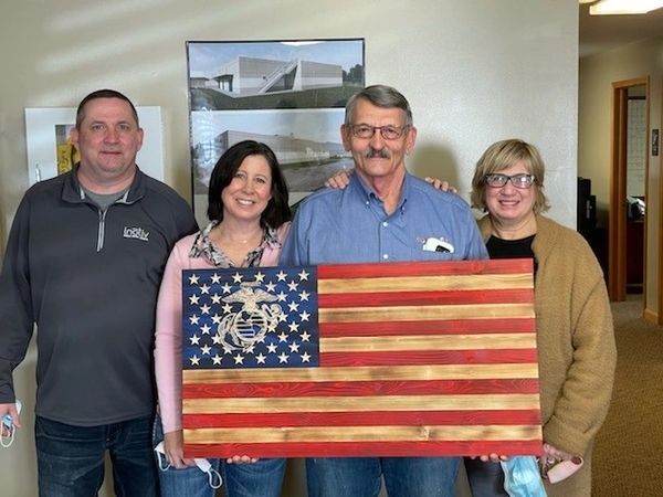 Marine Corps Eagle Globe and Anchor wooden flag with carved stars and emblem; a retirement gift.