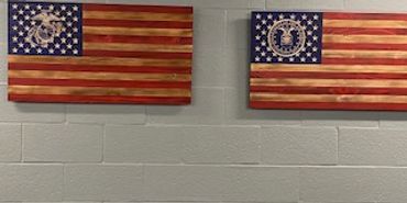 two military wooden flags