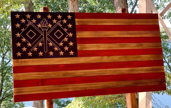 With the cross flags of the Army Signal Corps flag with carved stars
