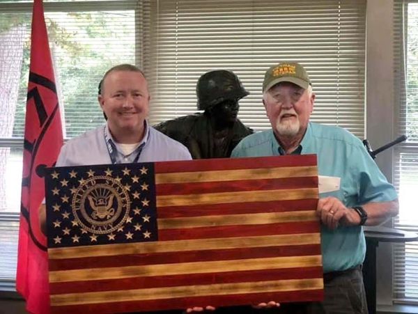 US Navy wooden flag is shown in Fayetteville, Arkansas.