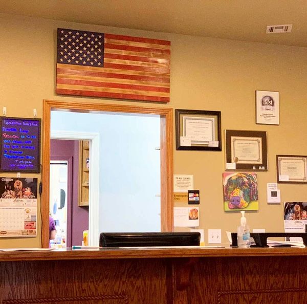 Patriot displaying his wooden American flag with carved stars