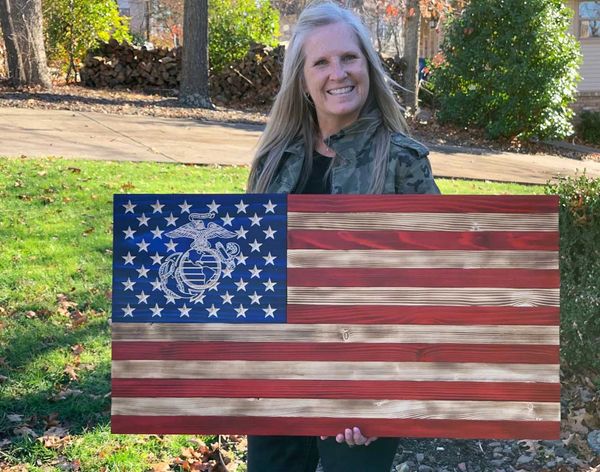 Marine Corps wooden flag was bought as a gift to her father.