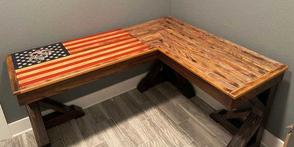 Unique display of a Marine Corps wooden flag with carved stars and emblem