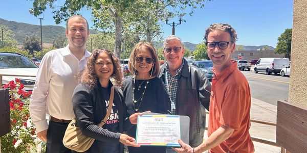 G2 Business Solutions Inc receiving a Certificate of Appreciation from our friends at Project Pearls