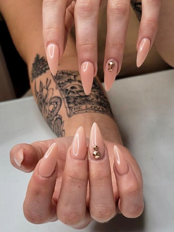NUDE RHINESTONES ACRYLIC NAILS DONE BY A NAIL TECHNICIAN