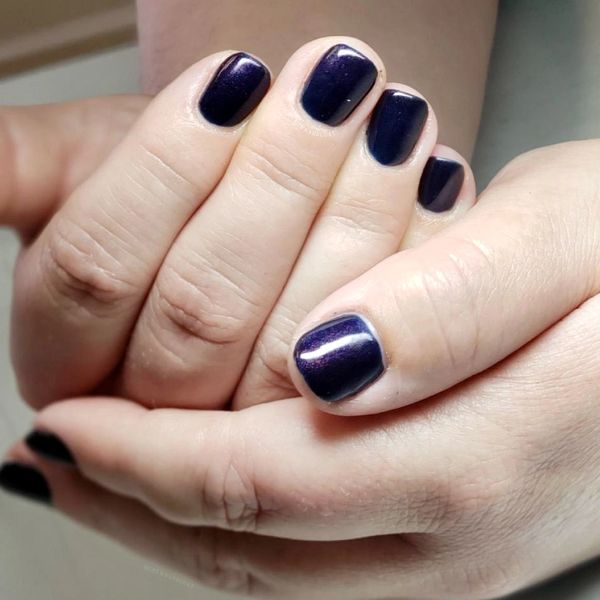 PURPLE MANICURE DONE BY A NAIL TECHNICIAN