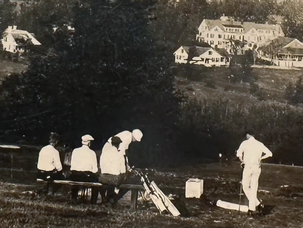 A golf outing in Worthington just before the hotel predominant in the photo, burned down.