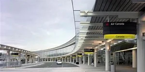 Airport terminal with Air Canada signs.