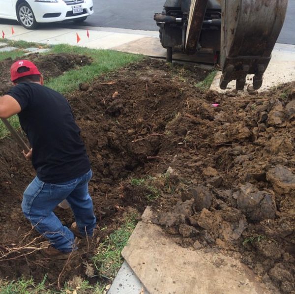 Staff member hard at work prepping for a new sewer line.