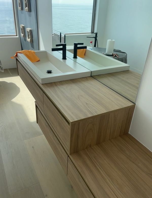 New faucet and sink installed in a master bathroom of a custom beach-home.