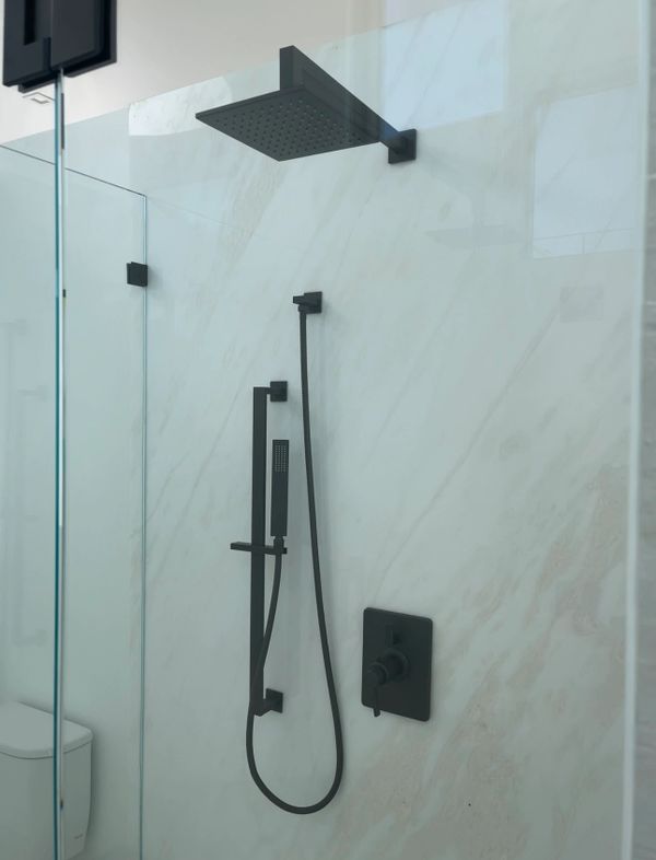 Rain shower head installed in this custom shower.