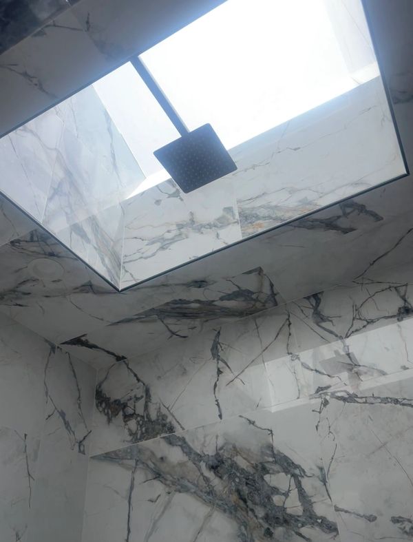 Shower head installed in a newly remodeled bathroom.