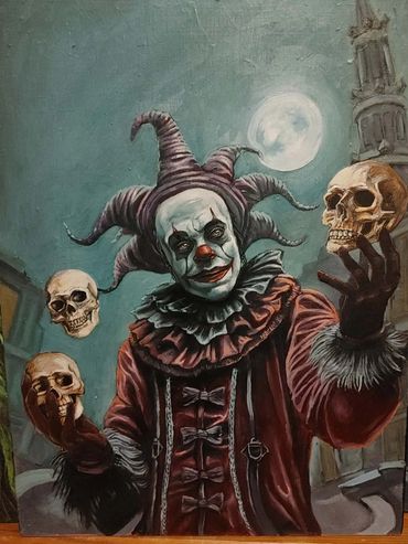 A Juggler clown in red and black. the balls are skulls.