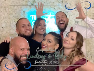 Six friends joyfully pose at Lindsey and Rody's December 31, 2023 celebration.