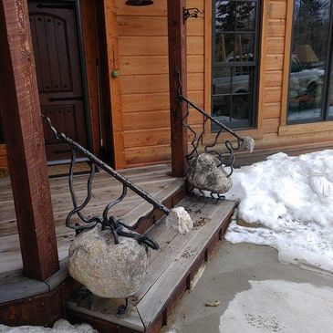 Custom forged metal and boulder railings Made in Montana.