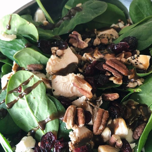 Spinach Feta Salad with dried cranberries, roasted pecans, roasted chicken and honey balsamic vinaig