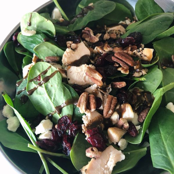 Spinach, Feta, Cranberry & Pecan salad topped with a Balsamic Vinaigrette