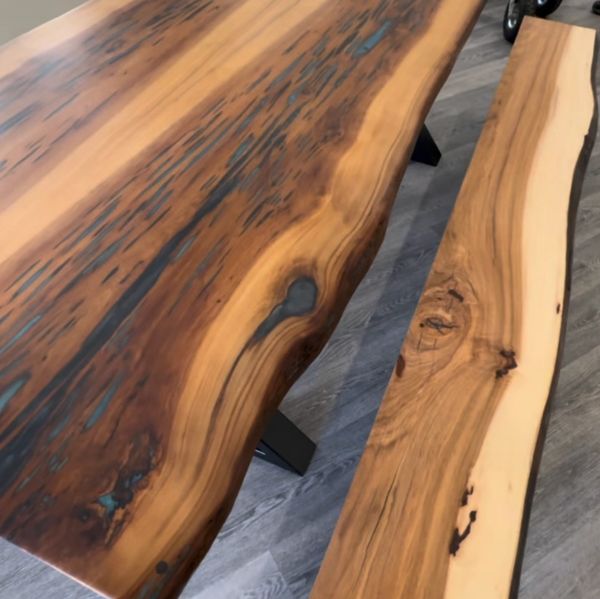 Live edge bookmatched sinker cypress dining table with Caribbean epoxy accents
