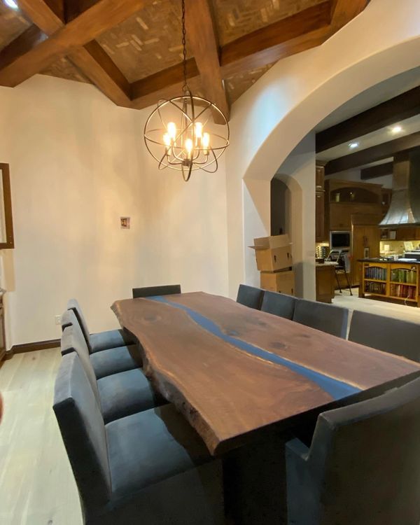 Walnut live edge dining table with dark turquoise