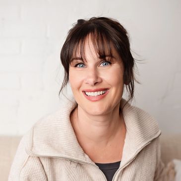 Professional headshot of a photographer in her studio