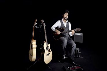 Jazz Bollywood singer guitarist at studio recording a medley arijit Singh kishore kumar songs