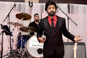 Jazz Indian Asian Bollywood male singer with Bollywood band at a wadding walima reception