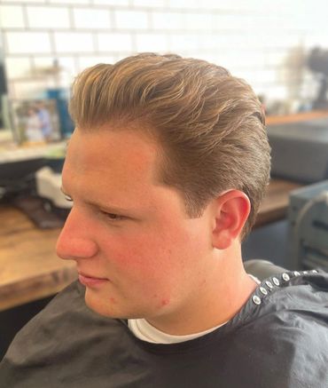 a medium length haircut with a nice razor line up
