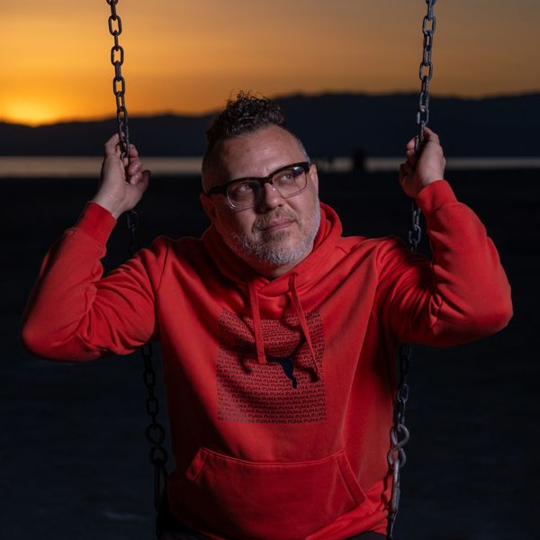 Southern California Photographer swinging around at Bombay Beach during sunset. Off camera flash.