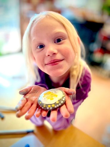Students share their artwork in the Kindness Rocks program at Creative Kids Child Care Cobleskill