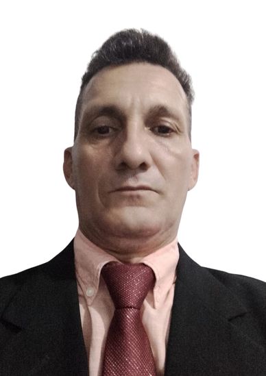 Man in formal attire with a red tie and pink shirt.